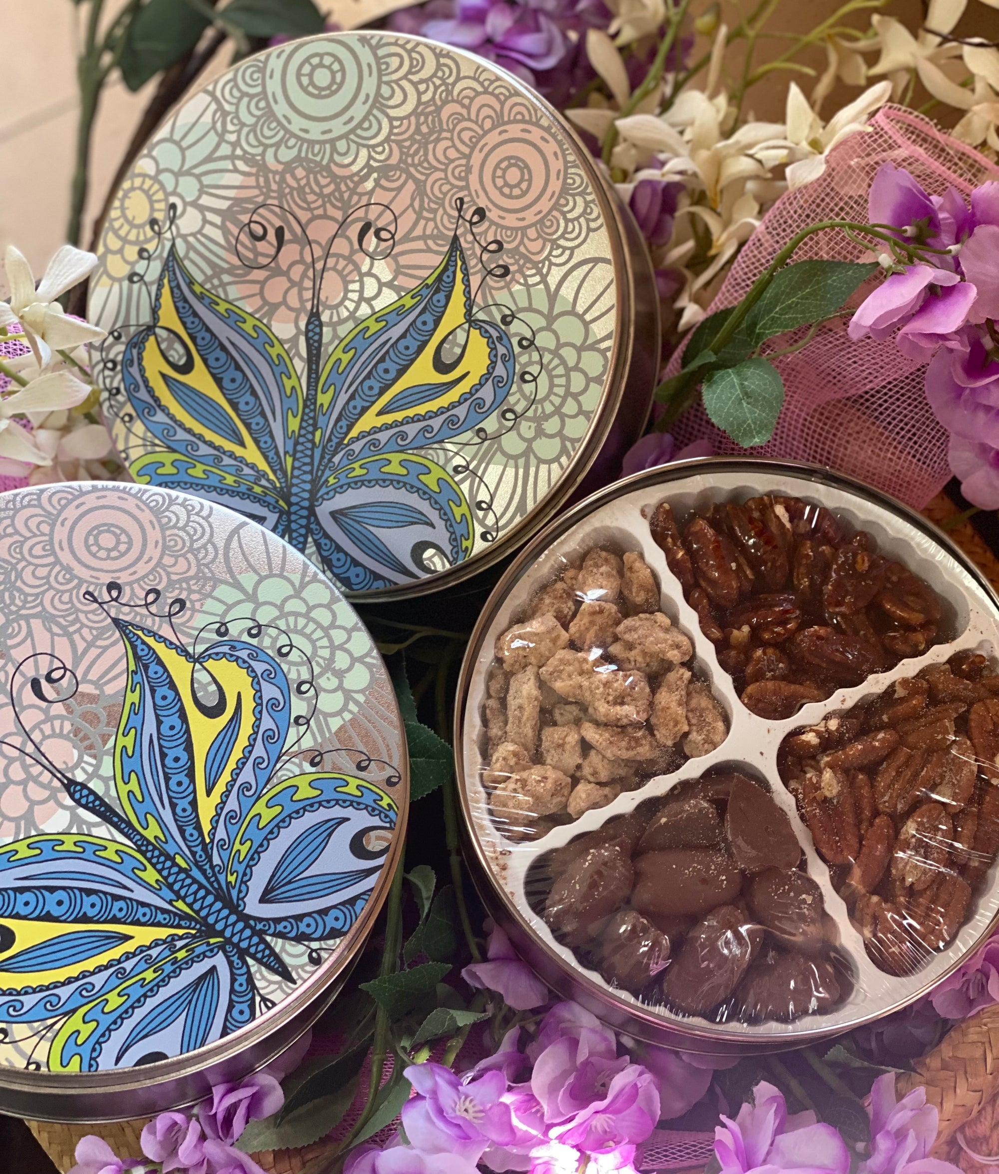 Decorative tin with four compartments filled with gourmet pecan treats - Renfroe Pecan Co, Pensacola FL