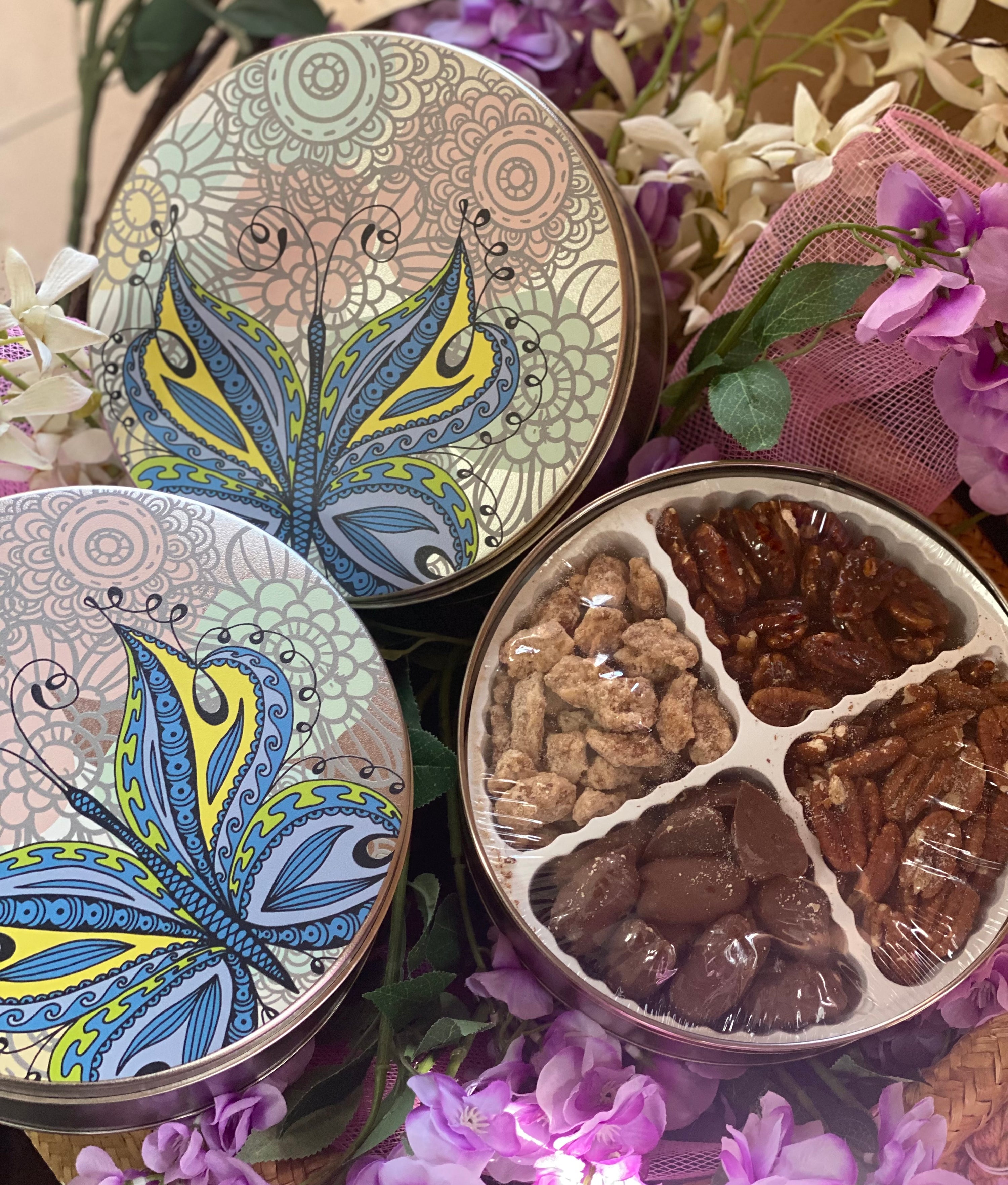 Decorative tin with four compartments filled with gourmet pecan treats - Renfroe Pecan Co, Pensacola FL